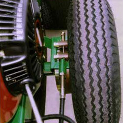 The Wheel Brake is activated by pulling the hand lever. This device locks the wheel so tha